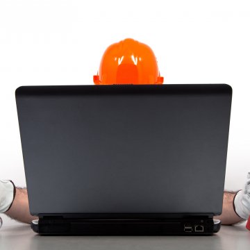 regclean pro registry cleaner system optimizer overview man with screwdriver and wrench in front of black laptop 